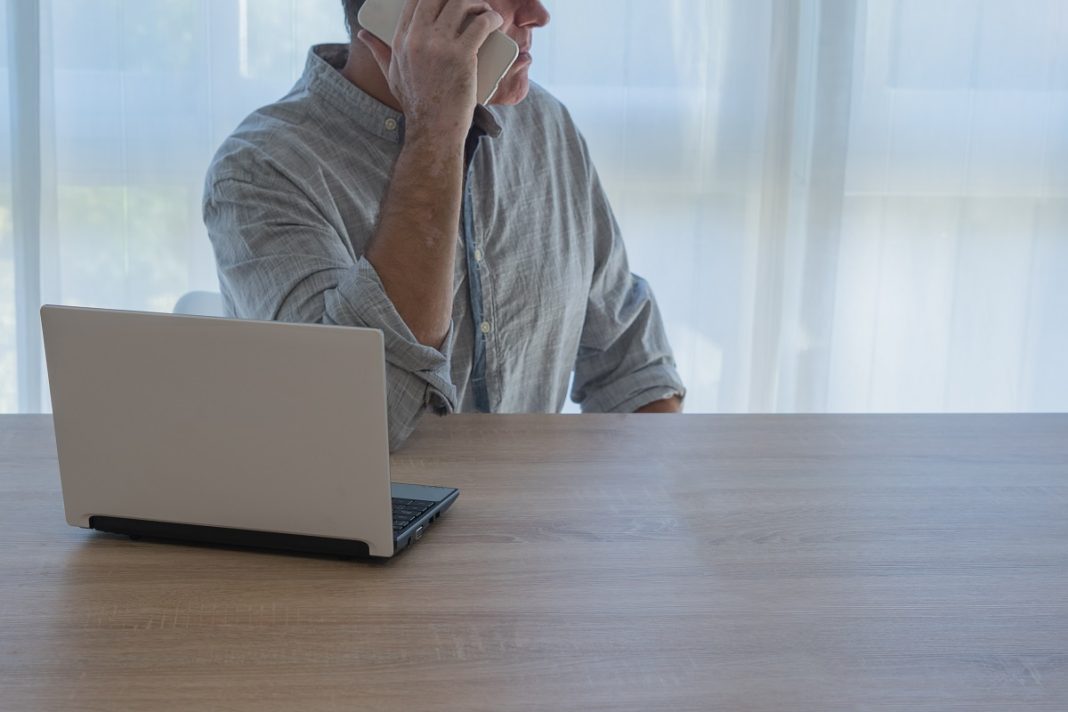 Man,With,Vitiligo,On,His,Skin,,Working,From,Home,,Talking